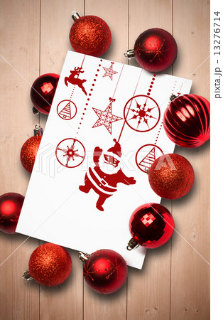Composite image of hanging red christmas decorations 13276714