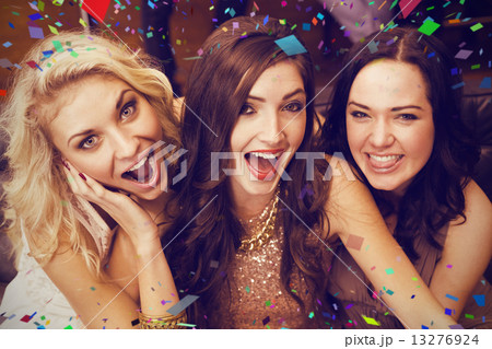 Composite image of happy friends making silly faces Composite image of happy friends making silly faces 13276924