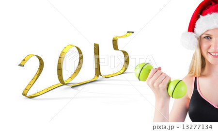 Composite image of festive fit blonde smiling at camera 13277134