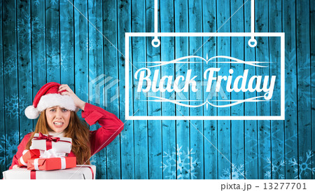 Composite image of festive stressed redhead holding gifts Composite image of festive stressed redhead holding gifts 13277701