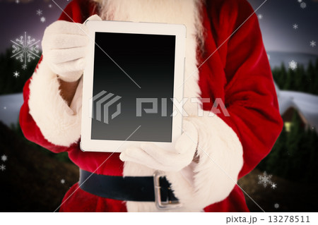 Composite image of santa claus showing tablet pc 13278511