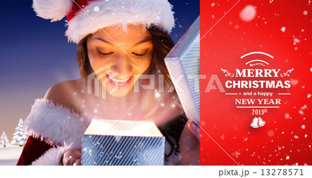 Composite image of sexy santa girl opening gift Composite image of sexy santa girl opening gift 13278571