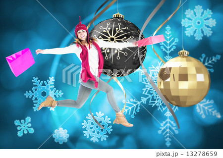 Composite image of happy brunette jumping with gifts bags 13278659