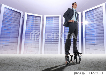 Composite image of business people supporting boss 13279351