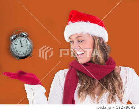 Composite image of festive blonde presenting with hand Composite image of festive blonde presenting with hand 13279645