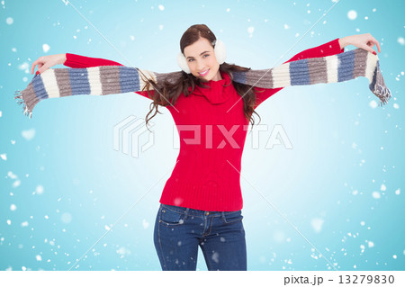Composite image of cheerful brunette holding scarf and spread he Composite image of cheerful brunette holding scarf and spread he 13279830