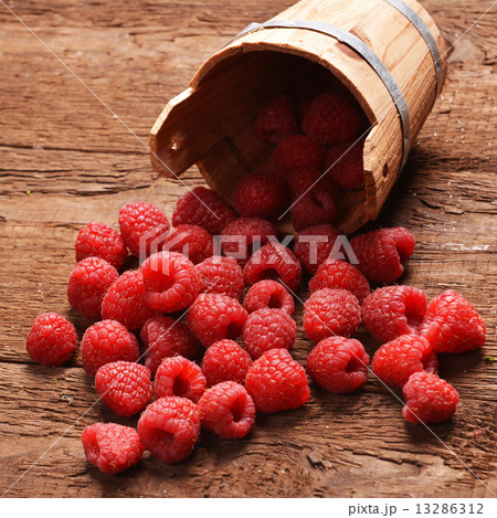 fresh raspberry in a basket on wooden table fresh raspberry in a basket on wooden table 13286312