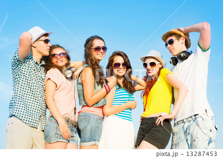 group of young people wearing sunglasses and hat group of young people wearing sunglasses and hat 13287453