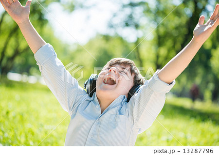 Boy enjoying music 13287796