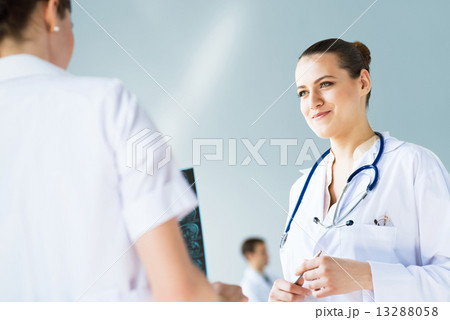 Doctor talking with a colleague Doctor talking with a colleague 13288058