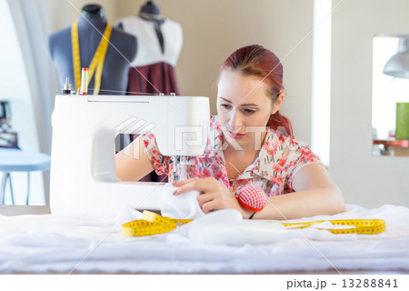 Seamstress at work 13288841