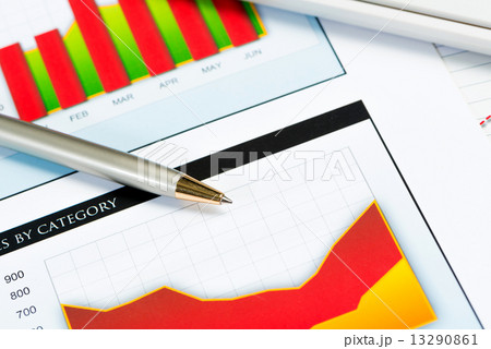 close-up of pen and financial growth charts close-up of pen and financial growth charts 13290861