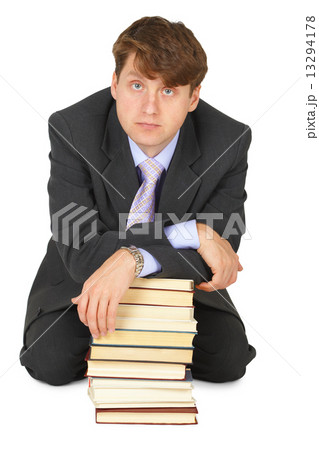 Young erudition man with stack of books Young erudition man with stack of books 13294178