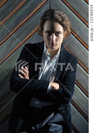 Portrait of a young man in dramatic light Portrait of a young man in dramatic light 13296834