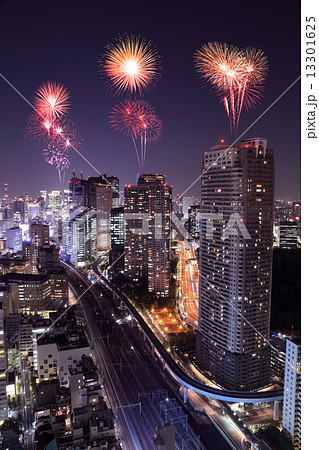Fireworks celebrating over Tokyo cityscape at night 13301625