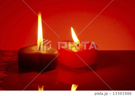 Two burning heart shaped candles Two burning heart shaped candles 13301986