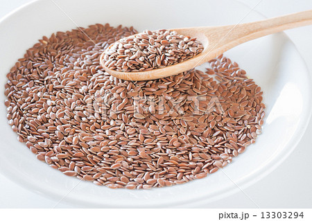 Brown flax seeds on a wooden spoon Brown flax seeds on a wooden spoon 13303294