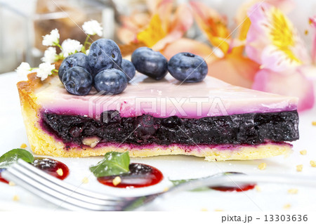 piece of blueberry pie on a table in a restaurant piece of blueberry pie on a table in a restaurant 13303636