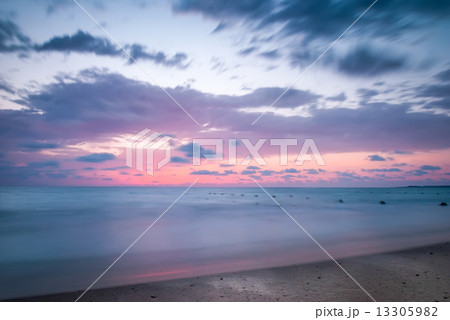 Tropical Beach with Empty Cage in the Sea at Sunset 13305982