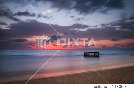 Tropical Beach with Empty Cage in the Sea at Sunset 13306019