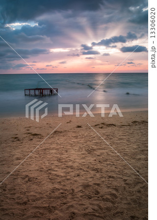 Tropical Beach with Empty Cage in the Sea at Sunset Tropical Beach with Empty Cage in the Sea at Sunset 13306020