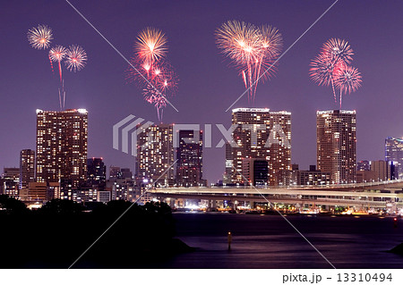 Fireworks celebrating over Odaiba, Tokyo cityscape at night 13310494
