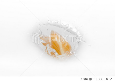 Side view of water with tangerine slice 13311612