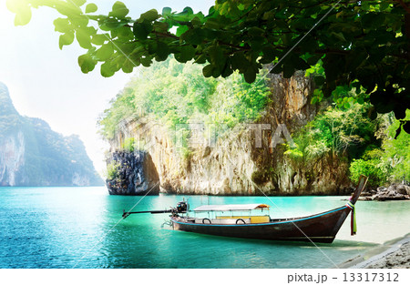 long boat on island in Thailand 13317312