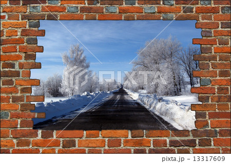 broken brick wall and view to Winter highway 13317609