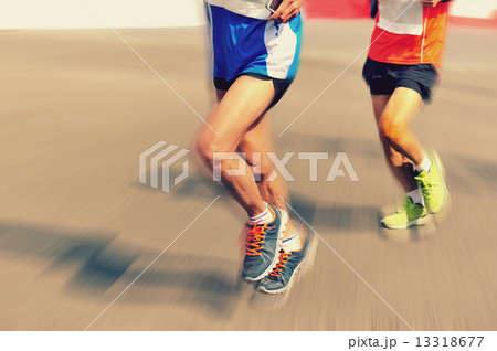 marathon athlete legs running on city road marathon athlete legs running on city road 13318677