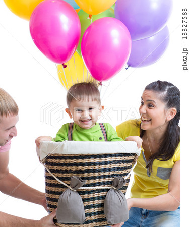 family play at birthday party and playing with son in flight on a makeshift balloon 13327583