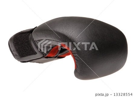 A single boxing glove on a white background. 13328554