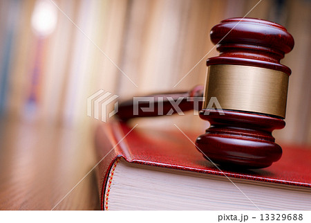 Judges gavel resting on a law book 13329688