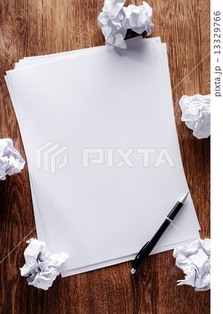 Blank sheets of paper with crumpled remnants 13329766