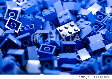 Concept of blue building blocks with focus and highlight on one particular block 13330309