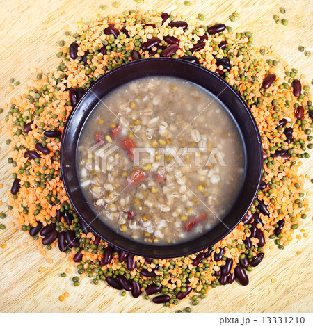 above view of beans soup in bowl on plate 13331210