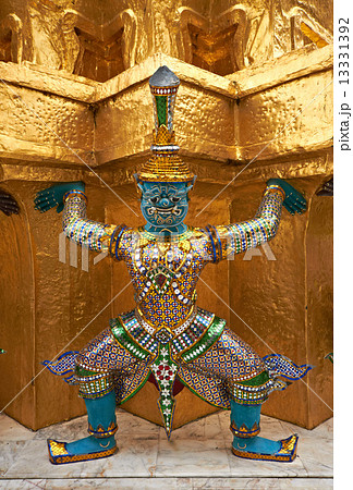 Colorful demon supporting golden stupa 13331392