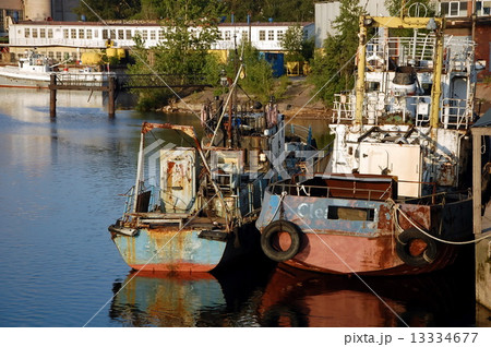 Cargo port on Kanonersky Island in Saint-Petersburg. Old abandoned vessels  13334677
