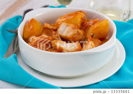fish stew in the bowl on white plate 13335681