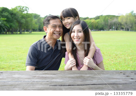 Family of 3 in the park Family of 3 in the park 13335779