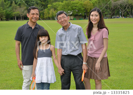 3 generations family day playing at the park 13335825