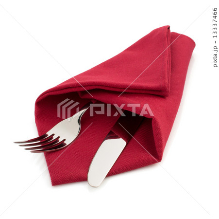 knife and fork at napkin on white 13337466