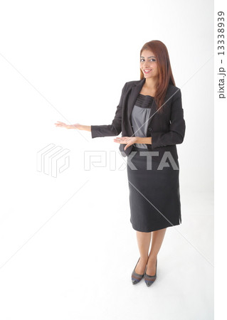 Woman standing shoiwng Woman standing shoiwng 13338939