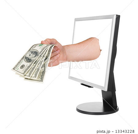 Hand with money and computer monitor Hand with money and computer monitor 13343228