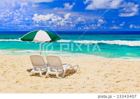 Chairs and umbrella at tropical beach 13343407