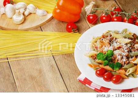 Pasta bolognese on the wooden table Pasta bolognese on the wooden table 13345081