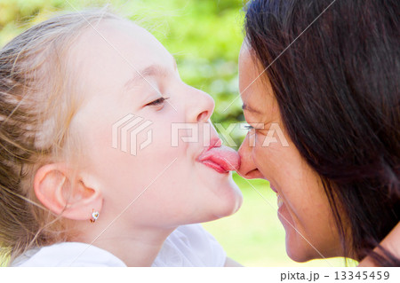 Kissing mother and daughter 13345459