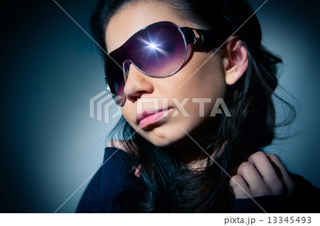 Portrait of a young girl in sunglasses 13345493