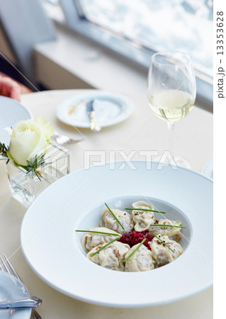 Meat dumplings served with beetroot salad Meat dumplings served with beetroot salad 13353628