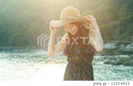 portrait of young beautiful woman wearing long dress and wide st 13354655
